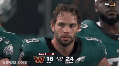 Man In Eagles Jersey Smiling In Front Of Scoreboard GIF