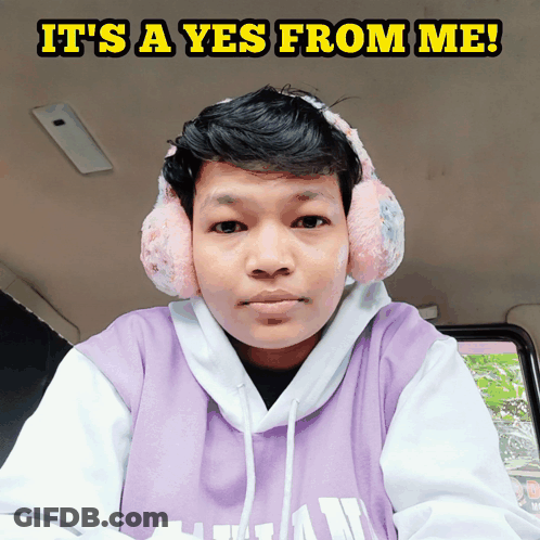 Man In Ear Muffs And Purple Hoodie Saying Yes GIF