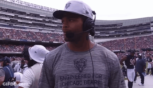 Man In Engineered For Chicago Bears Shirt In Stadium GIF