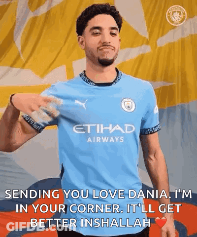 Man In Etihad Airways Shirt With Yellow And Blue Flag GIF