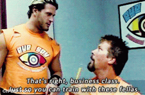Man In Eye Sow Shirt Talking To Another Man GIF