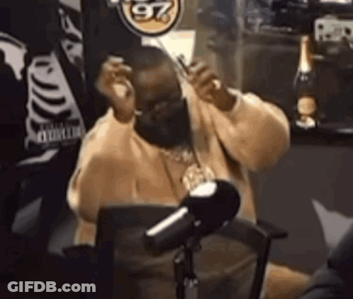 Man In Face Mask At Microphone GIF