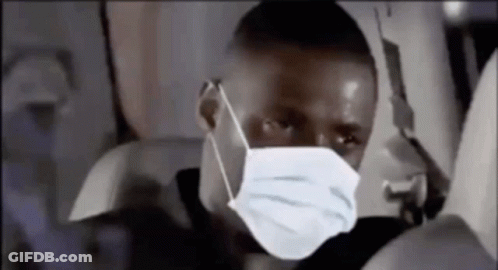 Man In Face Mask Sitting On Plane GIF
