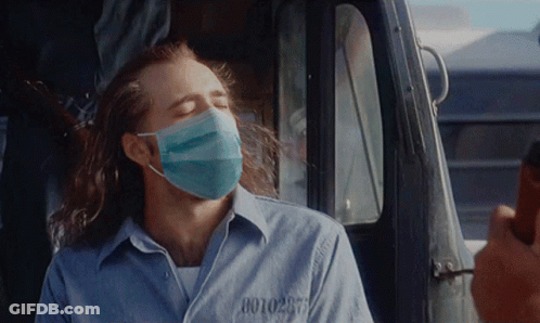 Man In Face Mask With Prison Number 0010297 GIF