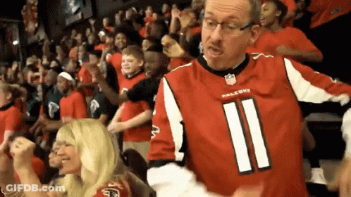 Man In Falcons Jersey Stands In Crowd GIF
