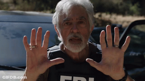 Man In FBI Vest Holding Hands Up In Front Of Car GIF