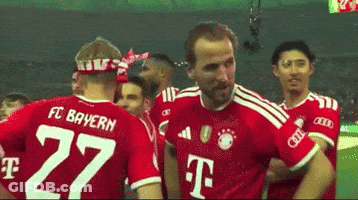Man In FC Bayern Jersey Hugging Another Man GIF