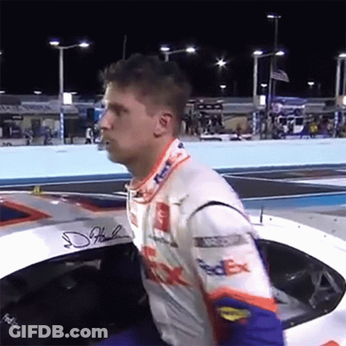 Man In FedEx Racing Suit Sitting In Race Car GIF