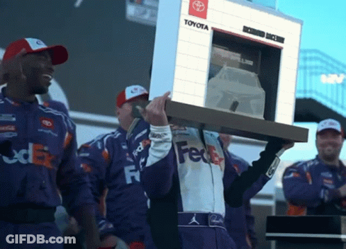 Man In FedEx Uniform Carrying Toyota Sign GIF