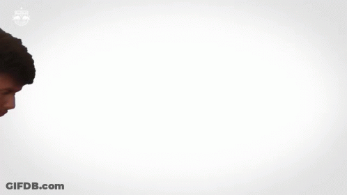 Man In FedEx Uniform Standing In Crowd GIF