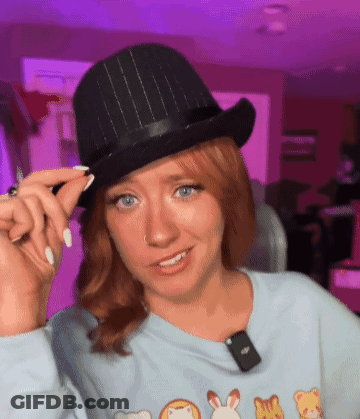 Man In Fedora Adjusting Plaid Scarf GIF