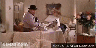 Man In Fedora At Messy Table GIF