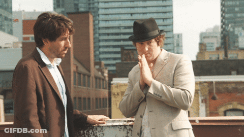 Man In Fedora Talking To Another Man GIF