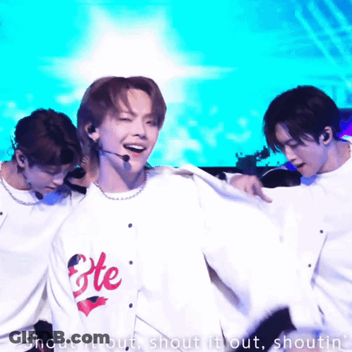 Man In Fete Shirt Dancing With Two Men GIF