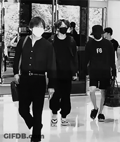 Man In FG Sweatshirt Walking With Others GIF