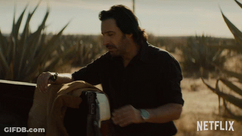 Man In Field With Netflix Logo GIF