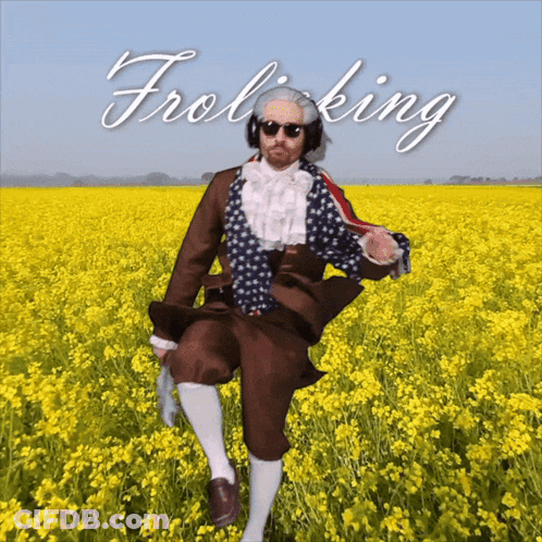 Man In Field With Word Frolicking Above GIF