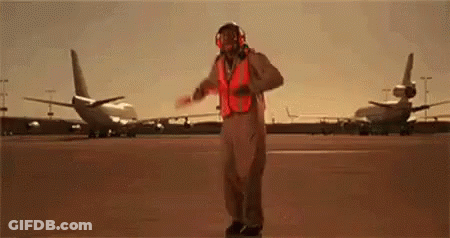 Man In Fighter Jet Costume Dancing On Runway GIF