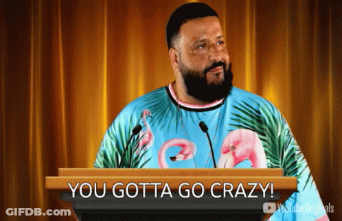 Man In Flamingo Shirt Behind Podium GIF