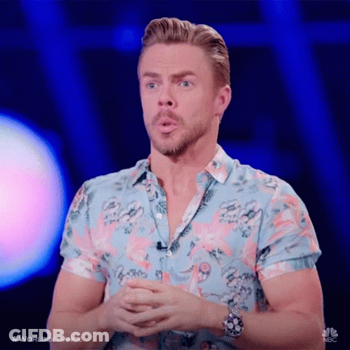 Man In Flamingo Shirt Folding Hands At Microphone GIF