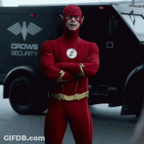 Man In Flash Costume In Front Of Crow Security Truck GIF