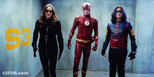 Man In Flash Costume Next To Woman And Man In Blue Jacket GIF