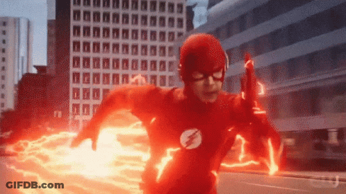 Man In Flash Costume Running Through City GIF