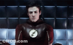 Man In Flash Costume Sitting GIF