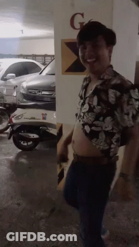 Man In Floral Shirt In Parking Garage GIF