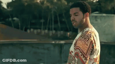 Man In Floral Shirt On Rooftop GIF