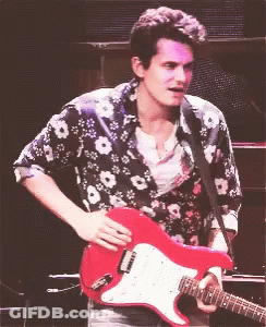 Man In Floral Shirt Playing Red Guitar GIF