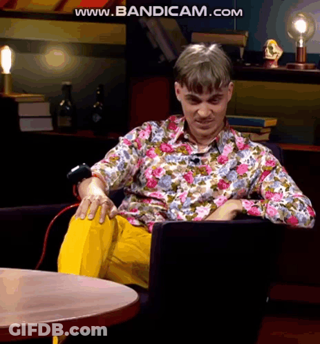 Man In Floral Shirt Sitting Cross-Legged Www.bandicam.com GIF