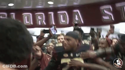 Man In Florida State Jersey Surrounded By Fans GIF
