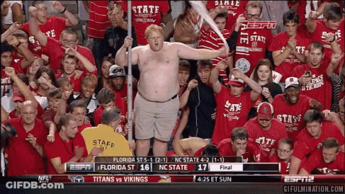 Man In Florida State Shirt Holding Bat In Crowd GIF