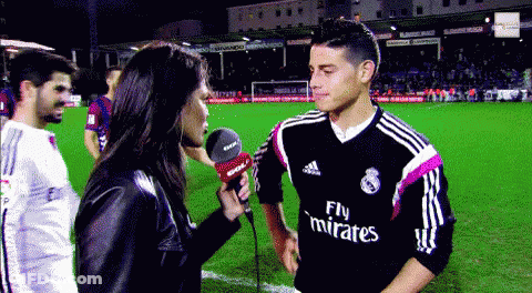 Man In Fly Emirates Jersey Being Interviewed GIF