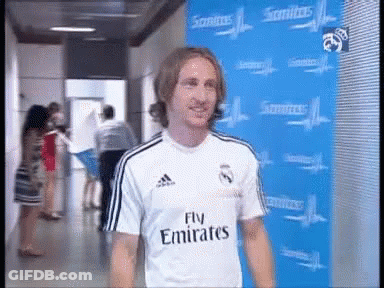 Man In Fly Emirates Shirt Blue Wall GIF