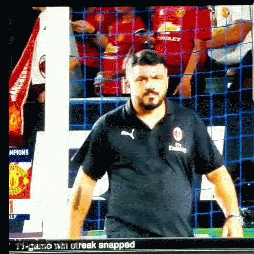 Man In Fly Emirates Shirt Standing In Front Of Net GIF