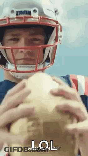 Man In Football Helmet Holding Football Saying LOL GIF
