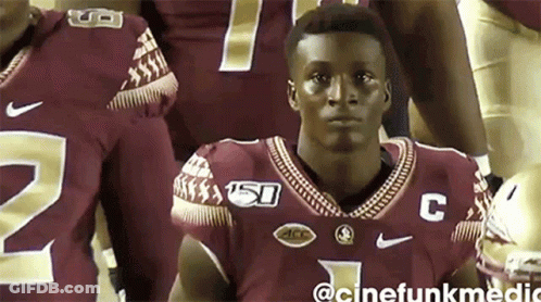 Man In Football Jersey With Letter C GIF