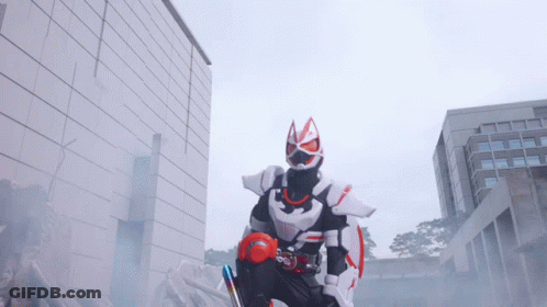 Man In Fox Costume In Front Of Brick Building GIF