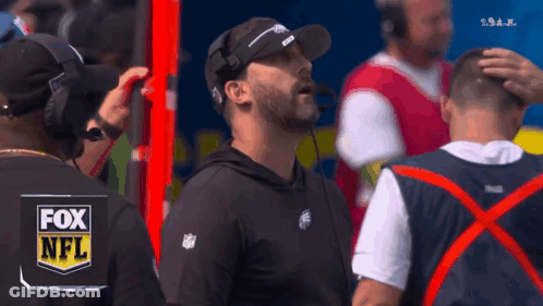 Man In Fox NFL Shirt On Sidelines GIF