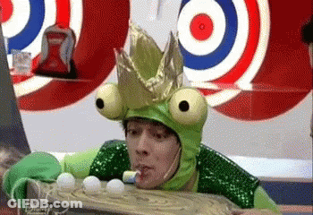 Man In Frog Costume And Crown Playing Game GIF
