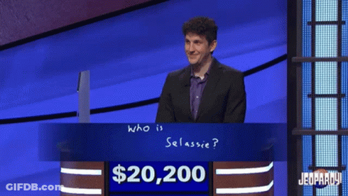 Man In Front Of $20,200 Jeopardy Sign GIF