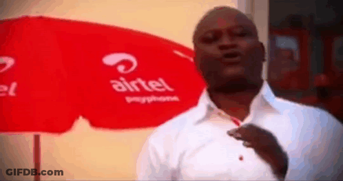Man In Front Of Airtel Umbrella GIF