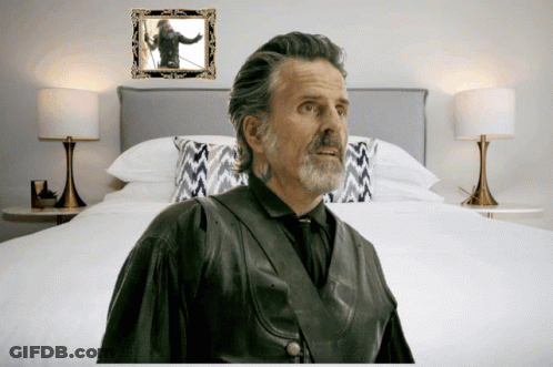 Man In Front Of Bed With Picture GIF
