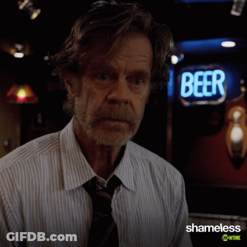 Man In Front Of Beer Sign GIF