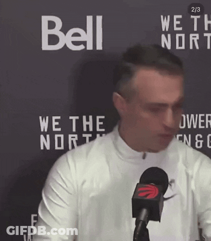 Man In Front Of Bell Sign GIF