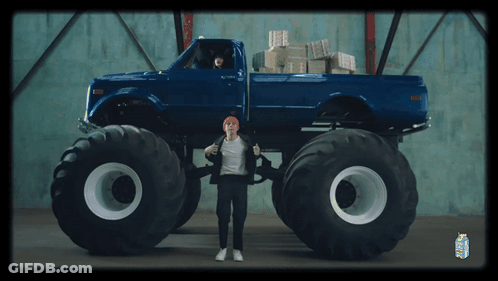 Man In Front Of Blue Monster Truck And Milk Carton GIF