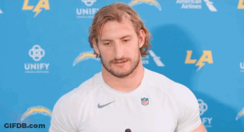 Man In Front Of Blue Wall Saying Unify GIF