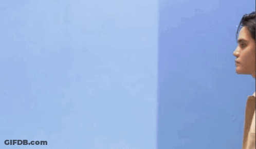 Man In Front Of Blue Wall With Yellow Pablo GIF